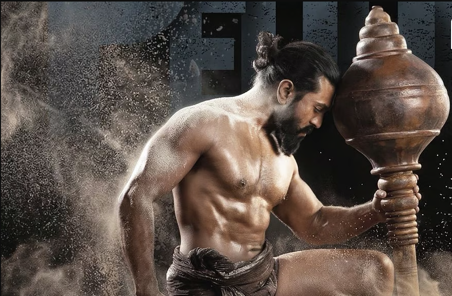 Peddi Ram Charan First Look | हातात गदा अन् पिळदार शरीरयष्टी! राम चरणचा ‘पेड्डी’मधील धाकड पैलवान लूक आऊट; वाढदिवशी चाहत्यांना मोठी भेट!